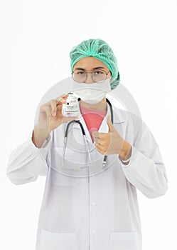 Portrait of Asian female doctor in white gown coat wearing eyes glasses in white background holding bottle of coronavirus covid 19
