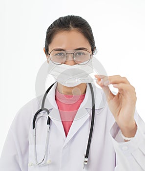 Portrait of Asian female doctor in white gown coat wearing eyes glasses in white background holding bottle of coronavirus covid 19