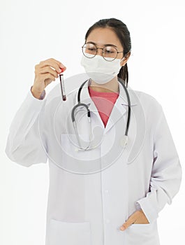 Portrait of Asian female doctor in white gown coat wearing eyes glasses in white background holding test tube of coronavirus covid