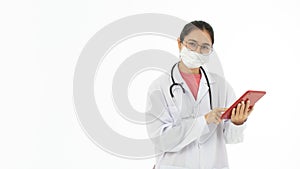 Portrait of Asian female doctor in white gown coat wearing protective hygiene mask and holding a tablet computer in hand. Isolated