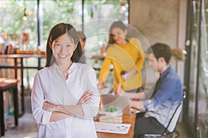 Portrait of asian female leader of working team coworking office ,Smiling of happy chinese girl in modern office