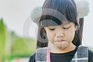 Portrait of asian girl crying in the park