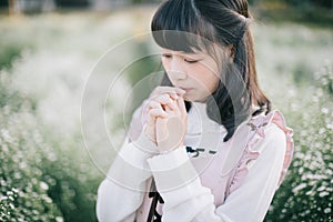 Portrait asian girl with little white flowers background