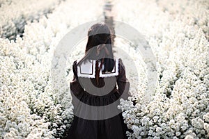 Portrait asian girl with little white flowers background