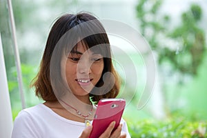 Portrait Asian girl with mobile