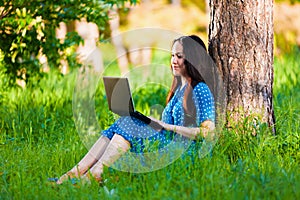 Portrait asian girl on nature with laptop