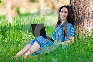 Portrait asian girl on nature with laptop
