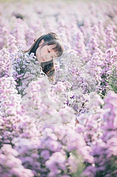 Portrait asian girl with purple flowers flowers background