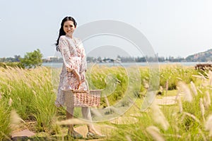 Portrait of an Asian girl seeking calm and tranquillity in a floral garden photo