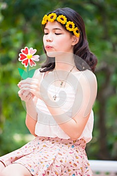 Portrait asian girl with toy flower