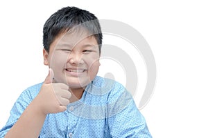Portrait of asian happy fat boy showing thumbs up gesture.