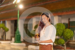 Portrait asian holding candle for pray and meditation