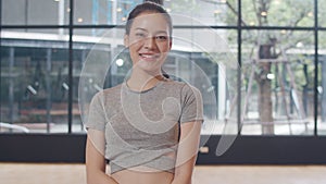 Portrait Asian japanese woman feeling happy fun at yoga class. Korean girl relax toothy smile looking to camera while exercising