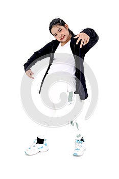 Portrait of Asian kid girl standing in casual posing on white background. Happy child studying modern style dance in studio