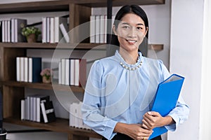 Portrait Asian lady secretary. Office employee businee woman worker happy smile photo