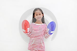 Portrait of Asian little child with concept blue and red boxing gloves isolated on white background