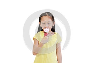 Portrait asian little child girl eating ice cream cone isolated on white background