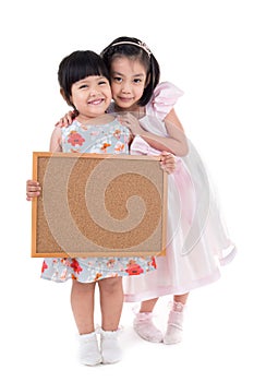 Portrait of Asian little girl hold wood board on white background