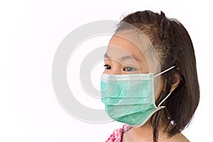 Portrait asian little girl in a medical mask isolated on white background,child wearing hygienic mask, concept of an epidemic, photo