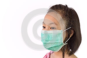 Portrait asian little girl in a medical mask isolated on white background,child wearing hygienic mask, concept of an epidemic,