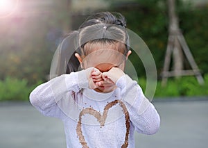 Portrait of asian little girl was crying in park outdoor