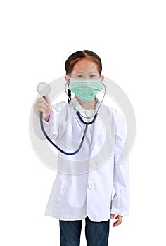 Portrait asian little kid girl showing stethoscope while wearing doctor`s uniform and medical mask isolated on white background.