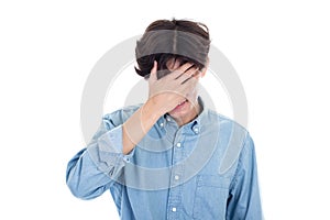 Portrait of Asian man covering his face with hands
