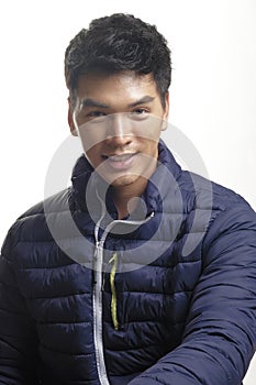 Portrait of Asian man in the down coat