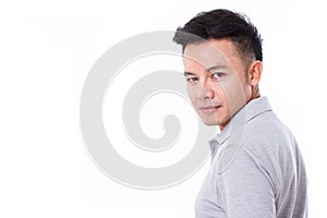 Portrait of asian man looking over his shoulder