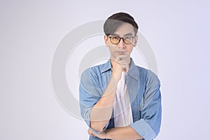 Portrait of asian man wearing glasses over white background studio, eyecare concept