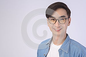 Portrait of asian man wearing glasses over white background studio, eyecare concept