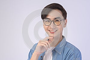 Portrait of asian man wearing glasses over white background studio, eyecare concept
