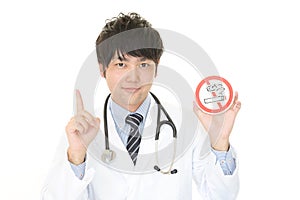 Doctor holds non smoking sign