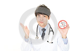 Doctor holds non smoking sign