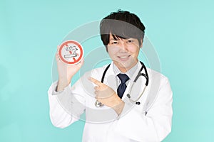 Doctor holds non smoking sign