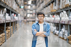 Portrait Asian men, staff, product counting Warehouse Control Manager Standing, counting and inspecting products in the warehouse