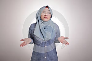 Muslim Woman shows Denial or Refusal Gesture, Shrug