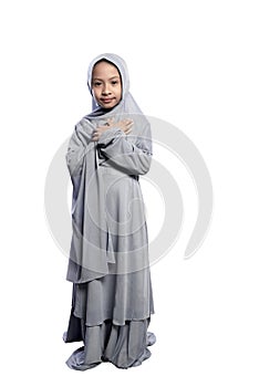 Portrait of asian muslim child wearing hijab standing