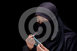Portrait Asian Muslim woman standing and reading the Quran and appreciates and faith