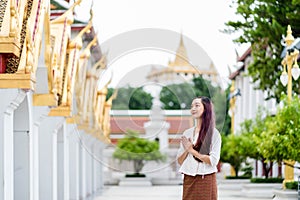 portrait Asian praying at Wat Ratchanatdaram bangkok