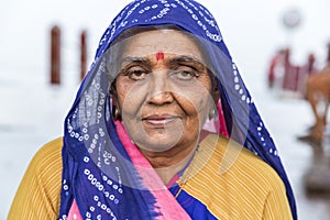 Portrait of Asian senior beautiful woman serious sad wearing traditional Indian dress sari.