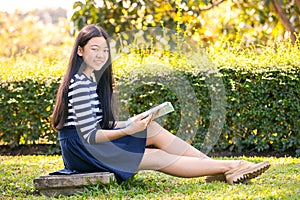 Portrait of asian teen twelve years old and school book in hand