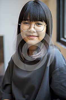 Portrait of asian teenager smiling with happiness mood