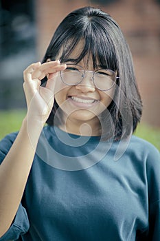 portrait of asian teenagerwearing casual clothes toothy smiling with happiness face