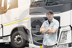 Portrait of Asian truck driver standing cross oneâ€™s arm looking with smile.