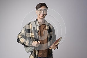 Portrait of an Asian university student over white background studio, education concept