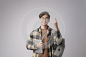 Portrait of an Asian university student over white background studio, education concept