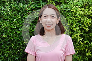 Portrait of an Asian woman in her 40s have a bright smile Young face, healthy body.