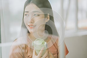 Portrait of asian woman practicing yoga at home