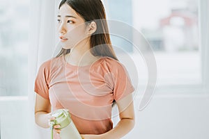 Portrait of asian woman practicing yoga at home